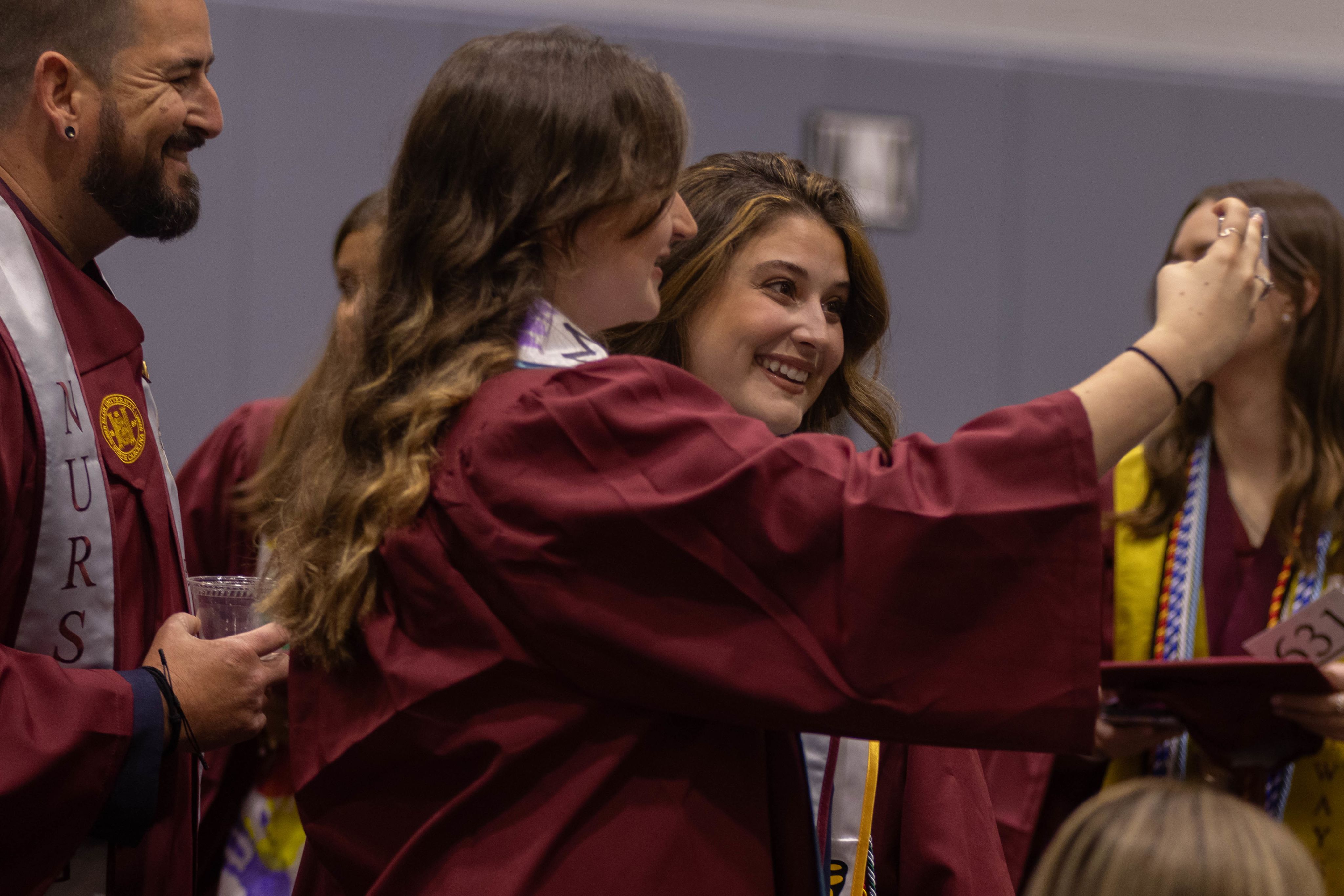 Two glowing jellyfish drift in the blue water.
