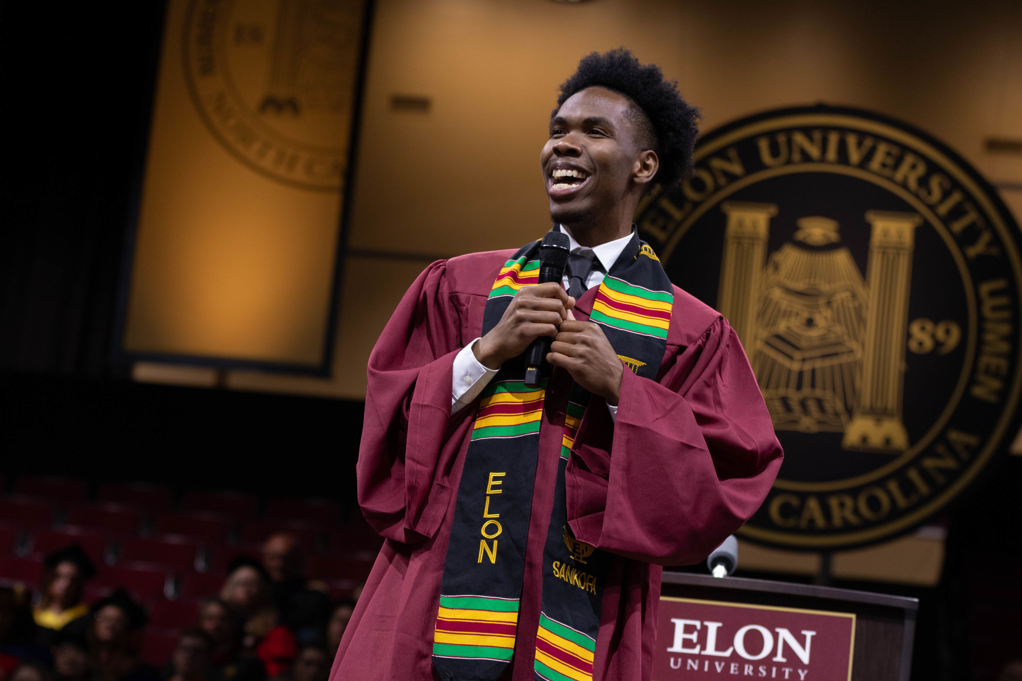 Two glowing jellyfish drift in the blue water.