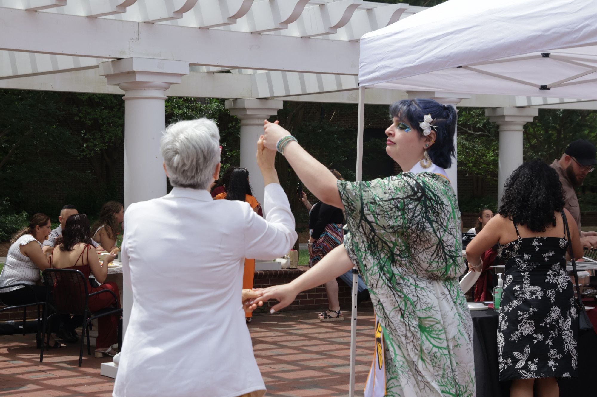Two glowing jellyfish drift in the blue water.